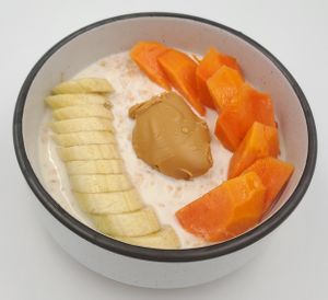 Vegan oatmeal with peanut butter and fresh fruit at SignatureThai Café & Tea House Restaurant in Krabi