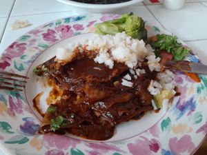 Enmoladas o enchiladas de mole. Esto es media porción, son muy grandes. at Comedor Angeles in Oaxaca