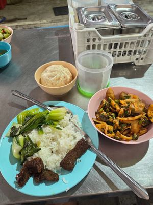 Bean sweet meat, vegetables with white rice, mushrooms laab, bao bun with vegan sweet meat inside at Raan Mae Anong Vegetarian - ร้านแม่อนงค์อาหารมังสวิรัติ in Bangkok