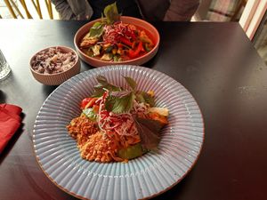 Fried rice noodles and vegan duck with black rice  at Akimy in Munich