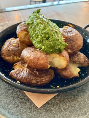 Smashed potatoes & vegan spinach & almond pesto  at Cult n' Art Café in Alvor