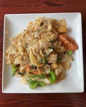 Drunken Noodle with tofu. Pan fried wide rice noodles, bell pepper, onion, tomato, basil. at Joy's Pattaya Thai Restaurant in Richfield