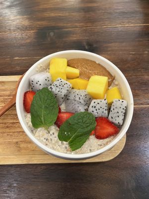 Overnights oats with chia seeds - underneath was banana and on top strawberry, dragonfruit, mango and peanut butter.   at The Hanoi Cafe in Hanoi