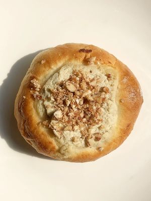 Vegan vatrushka with sweet tofu and grilled almonds at Daner Pizza in Tbilisi