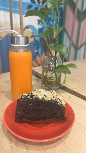 Chocolate cake and sunset juicee  at iVegan Supershop Old Quarter Hanoi - Healthy Plant Based Cafe in Hanoi