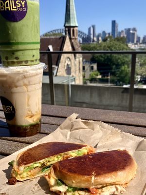 Matcha w/ cheesecake whipped cream on top, eggnog bubble tea bottom  at Ballsy Tea in North Sydney