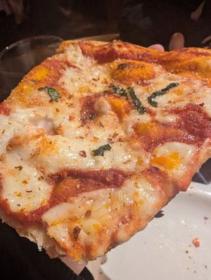 Cheese ny slice close up at Renato's in Bristol