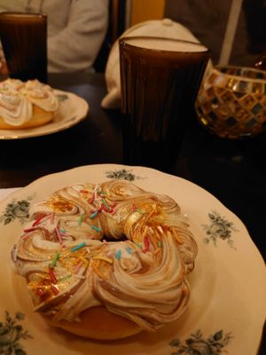 Donut with gold, sprinkles and plantbased whipped cream at Nomi the Karakal in Malmo