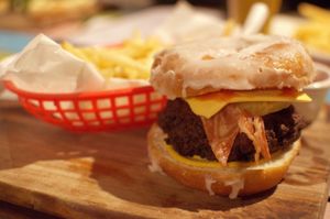 Luther burger ('beef' patty, maple candied facon, cheez and pineapple tucked into a house-made glazed donut) at Cornish Arms in Brunswick
