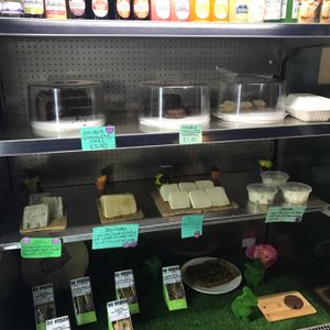 deli counter with drinks, cake and sandwiches at Samphire Brasserie in Plymouth