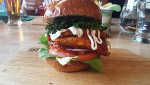 Don't Kale My Vibe burger - BBQ Tempeh, Lettuce, Tomatoes & Red Onion topped with Crispy Kale at Samphire Brasserie in Plymouth