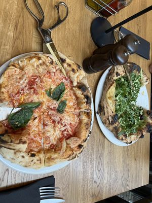 Margarita left and Ortolana right with scissors for cutting the pizzas  at nuva pizza in Leipzig