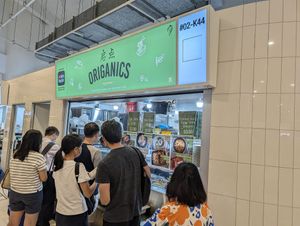 Long queue  at Origanics - 启点 - Sengkang Grand Mall in Northeast Singapore
