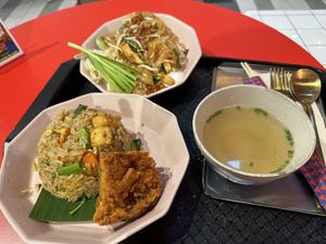 Drunken fried rice (the best, particularly the crispy side that comes with it!), Pad Thai, and a complimentary soup broth   at V Street - Emsphere in Bangkok