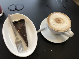 Trillionaires cake and a coffee   at VeGaNuTi in Yeovil