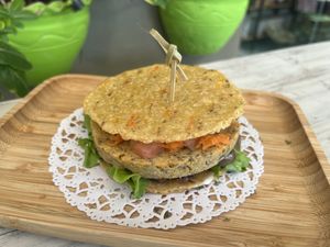 Delicious arepa burger on tortillas  at Clover Coffee + MarketPlace in Oranjestad