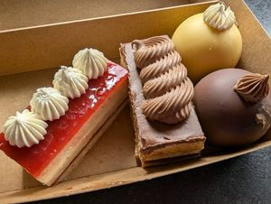 L - R: Strawberry and Lemon Opera, Coffee and Chocolate Opera, Passionfruit Rocher, Biscoff and Chocolate Rocher at GingerSnap Patisserie in West Melbourne