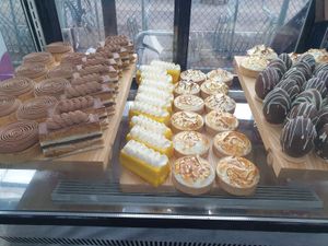 Salted caramel and chocolate tart; Passionfruit+mango mousse cake; Lemon meringue tart; Blackforest egg at GingerSnap Patisserie in West Melbourne