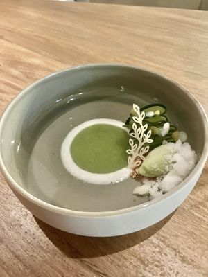 Second dessert thinly sliced cucumber with coconut ice cream , coconut powdered flakes and crystallized sugar  at Infini in Noord