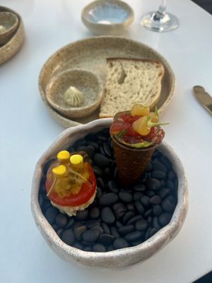 First appetizer served outside with GF sourdough bread and vegan maple butter  at Infini in Noord