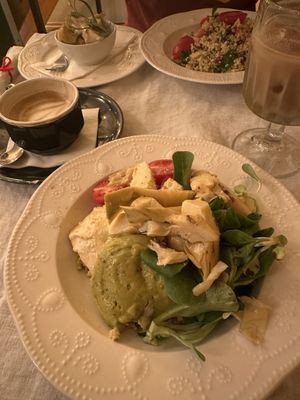 Buddha bowl, tabbouleh with artichoke, oat iced latte & oat cappuccino.    at Béchamel in Budapest