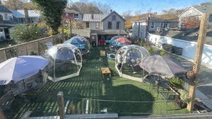 Outdoor seating area with heated bubbles for cold and rainy times at Salad Saloon  in Occoquan