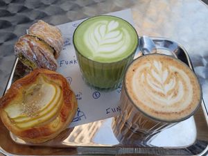 Pistachio cruffin, apple pastry, matcha and pumpkin latte at Bakkerij FUNK in Antwerpen