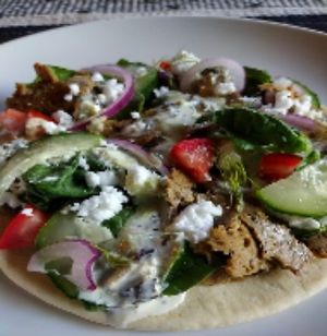 Gyro

Warmed Pita, "Honest Pasture's Gyro Beaf" slices, Cucumber, Tomato, Onion, Spinach, Vegan Feta & homemade Cashew-Tzatziki Sauce.  Comes w/side of plain Kettle Chips & Pickl at The Winnesota Wonder in Oak Park Heights
