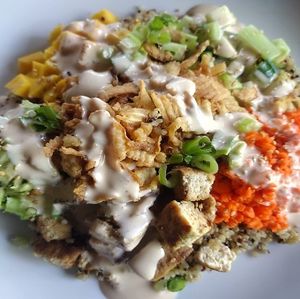 Mango Poke Bowl

Seasoned Grilled Tofu, Mango, Shredded Carrot, Cucumber, Avocado, French Fried Onion Rings, Green Onions,  homemade YUM Sauce, sesame seeds, on seasoned Quinoa. at The Winnesota Wonder in Oak Park Heights