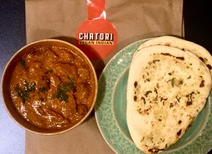 Tasty Jaipur plant-based chicken curry and garlic naan at Chatori Vegan Indian  in London