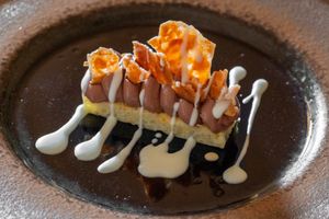 Chocolate mousse, almond, rice cake at Bis Osteria Italiana Contemporanea in Colle Di Val Delsa