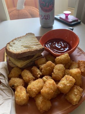 tots and brekky sandwich   at October Cafe in Chicago