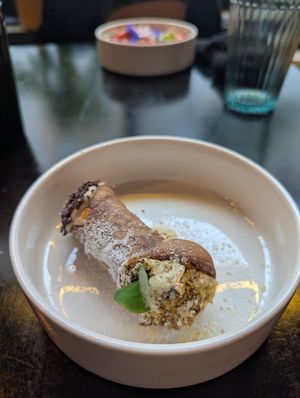 dessert: canolo with vegan ricotta, orange, pistachio & chocolate at Planttrekkerij  in Antwerpen