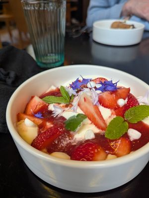 dessert: pavlova with strawberry, vegan meringue, red berry coulis & whipped cream at Planttrekkerij  in Antwerpen