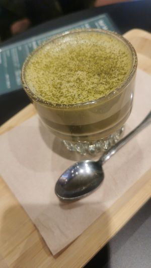 Mango matcha latte elixir with oat milk at Cafe Frei in Budapest