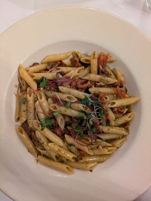 Penne with pesto and sun-dried tomatoes at NOLITA Italian Food and Wine Restaurant in Seattle