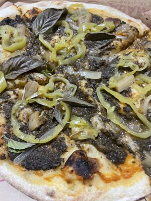 Strange pizza, but it kind of works. The banana peppers are sweet. (Replaced cheese for mushroom sauce)   at Nomada   in Santa Marta