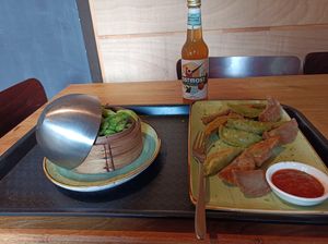 Bro-shi-to and mushroom lover dumplings with spicy tomato sauce and side of edamame at Momos - Organic Veggie Dumplings in Berlin