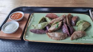 various dumplings with creamy mint and spicy tomato dip at Momos - Organic Veggie Dumplings in Berlin