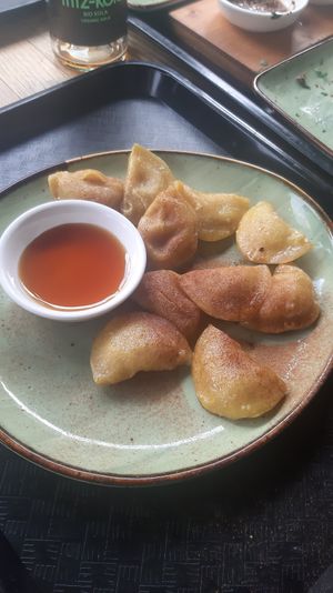 sweet dumplings with banana filling and maple syrup dip at Momos - Organic Veggie Dumplings in Berlin