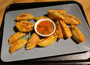 Medium dumpling plate with soy sesame dip at Momos - Organic Veggie Dumplings in Berlin
