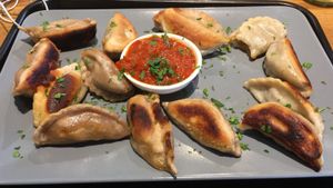 Fried Broccoli-Shiitake-Tofu and Mushroom-Potato Dumplings with Mitho Dip at Momos - Organic Veggie Dumplings in Berlin