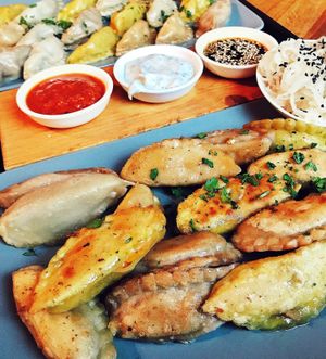 we got the “Momo’s Experience” - half fried, half steamed, all 4 fillings and 3 sauces. Plus a side of the fermented radish salad at Momos - Organic Veggie Dumplings in Berlin