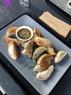 Fried dumplings with soy-sesame at Momos - Organic Veggie Dumplings in Berlin