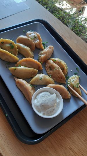 "Hot Potato" and "Cheeky Chickpea" dumplings, steamed, with lemon-mint dip at Momos - Organic Veggie Dumplings in Berlin