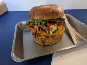 Burger with celeriac steak, slaw, vegan cheese at Eden Jaxx - Illum in Copenhagen