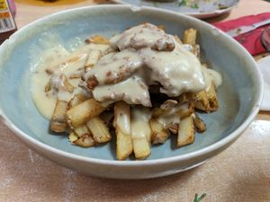 Cheese fried cutlets with home fries at La Galla Tasca Vegana in Barcelona