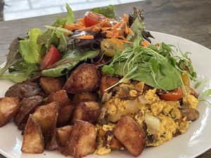 Tofu scramble with salad and crispy potatoes   at Peacock Pansy in San Francisco