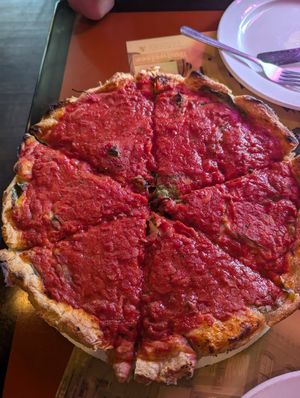 Fully loaded 12" deep dish pizza at Kitchen 17 in Chicago