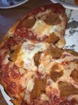 personal deep dish pizza with garlic and pepperoni  at Kitchen 17 in Chicago